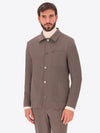 A model wearing a Distretto12 High Performance stretch jacket in matte grey.