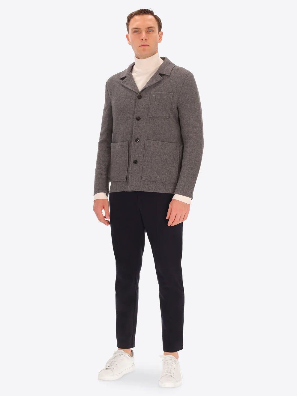 Male model wearing grey blazer by distretto12 with navy trousers