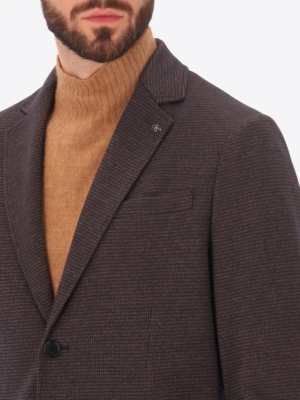 Male model wearing micro patterned jacket by distretto12 in brown with high neck knitwear