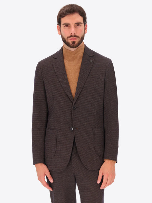 Male model wearing micro patterned jacket by distretto12 in brown