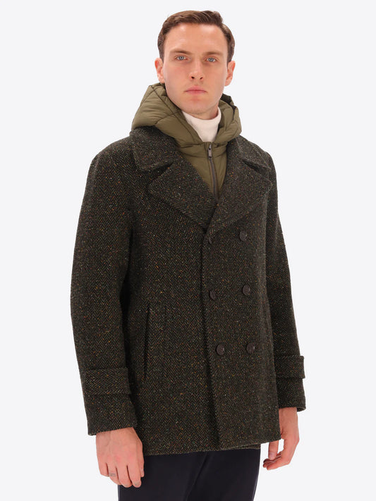 Male model wearing green peacoat with detachable hood insert by distretto12 with micro pattern