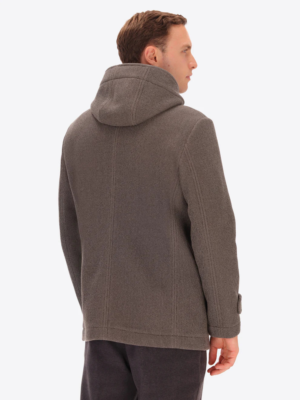 Male model wearing mud coloured parka by distretto12 with back view