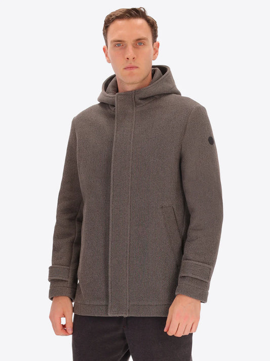 Male model wearing mud coloured parka by distretto12 