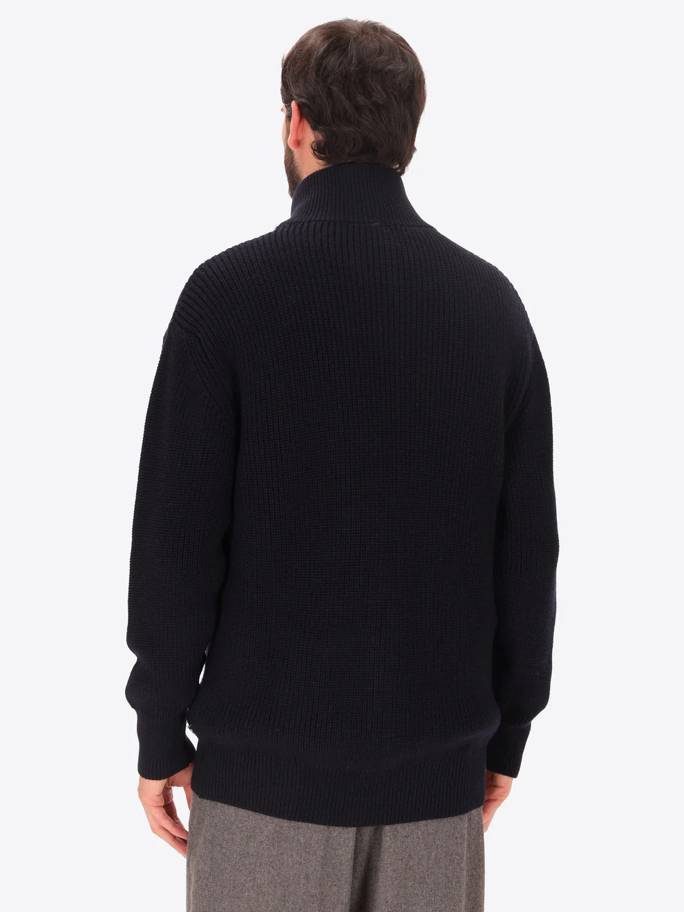 Male model wearing buttoned funnel neck knitwear with insulating layer by distretto12 in navy with back turned
