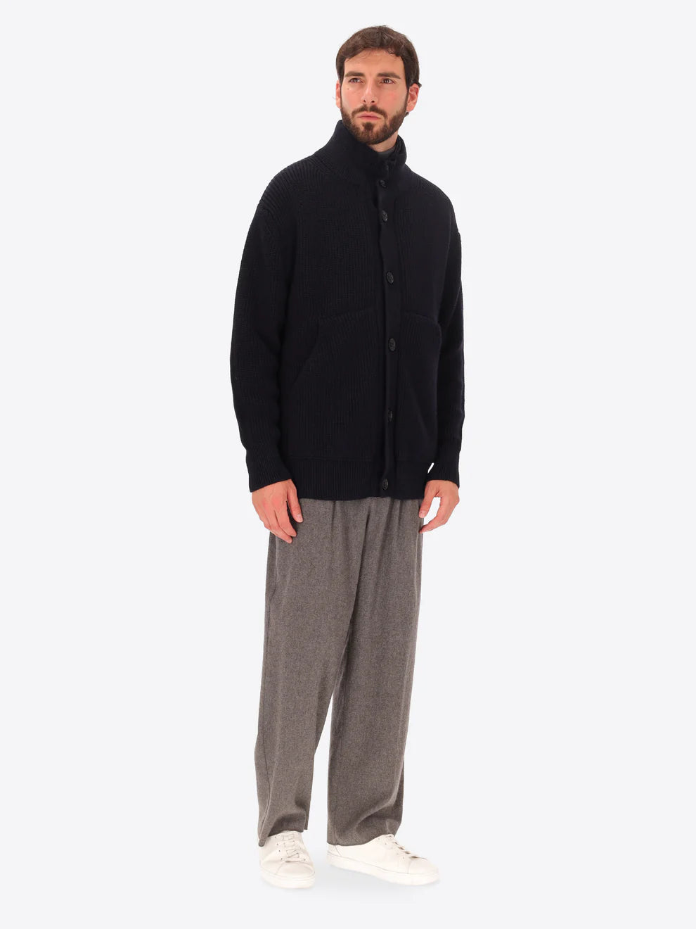 Male model wearing buttoned funnel neck knitwear with insulating layer by distretto12 in navy