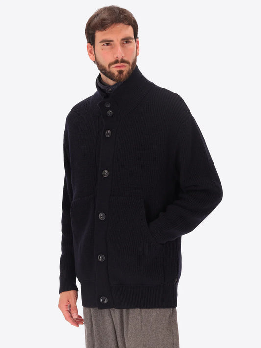 Male model wearing buttoned funnel neck knitwear with insulating layer by distretto12 in navy