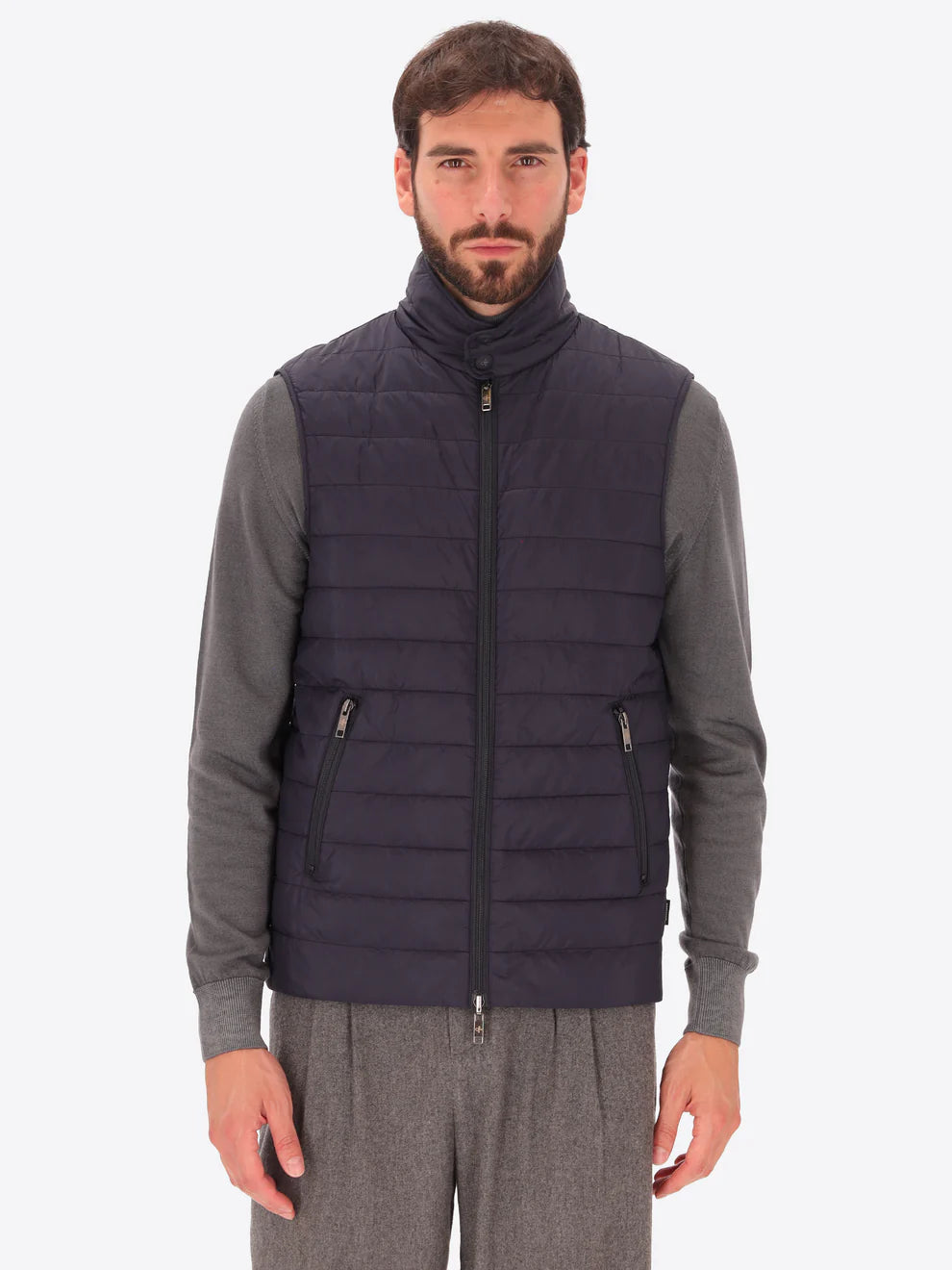 Male model wearing funnel neck, detachable insulating gillet by distretto12 in navy