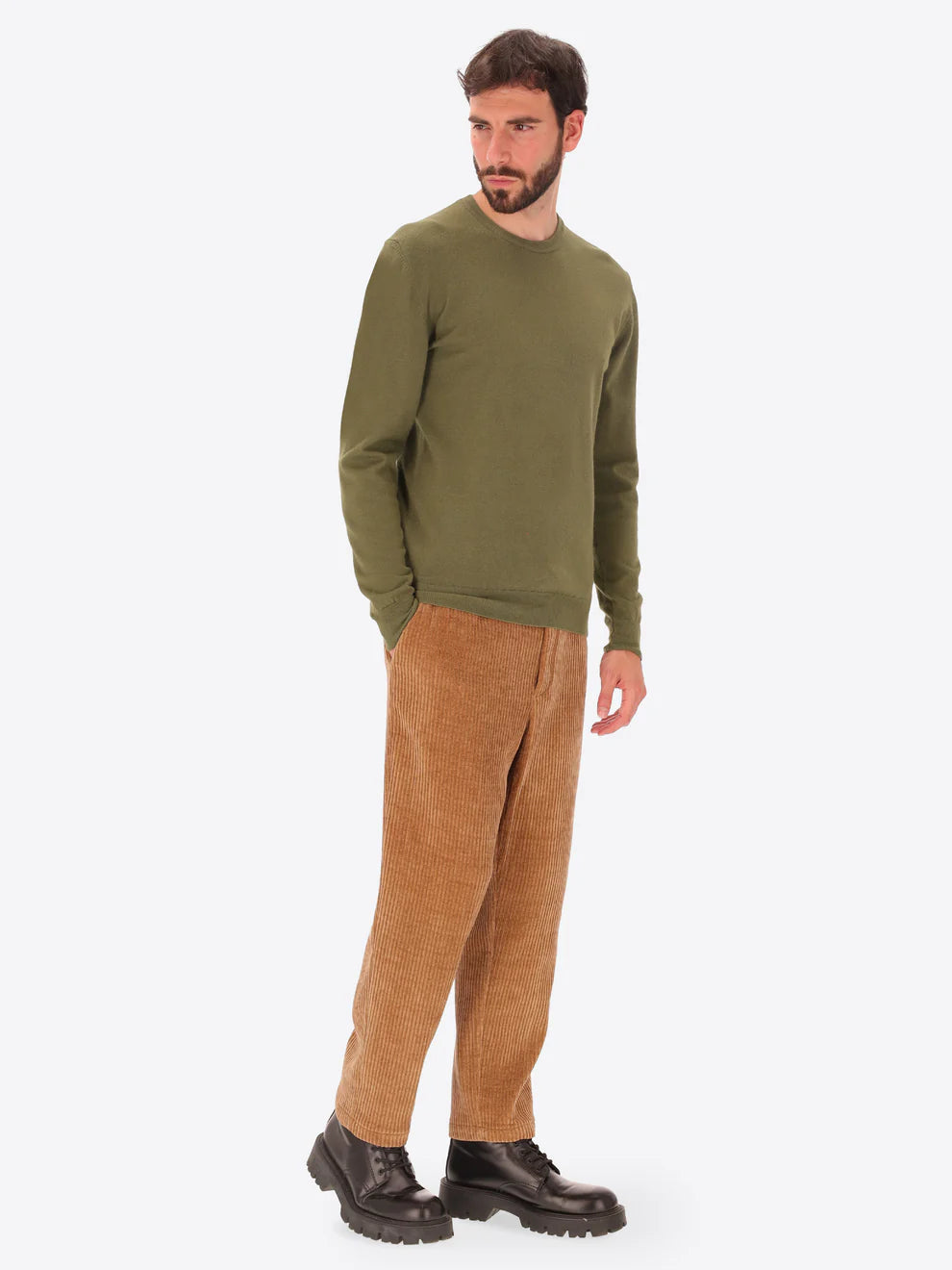 Male model wearing crew neck knitwear by distretto12 in green with corduroy trousers