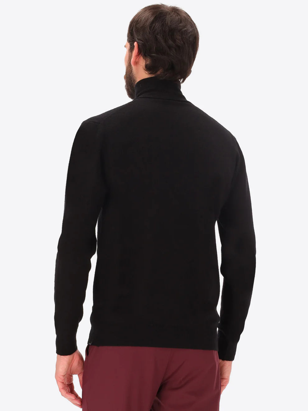 Male model wearing high neck merino blend knitwear by distretto12 in black with back view