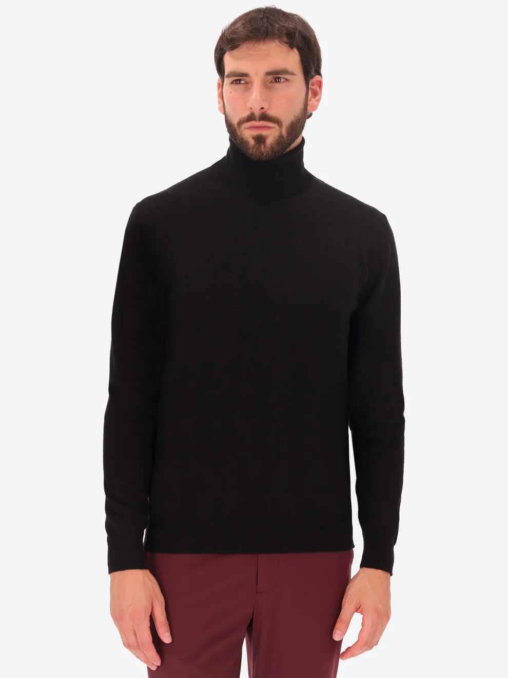 Male model wearing high neck merino blend knitwear by distretto12 in black