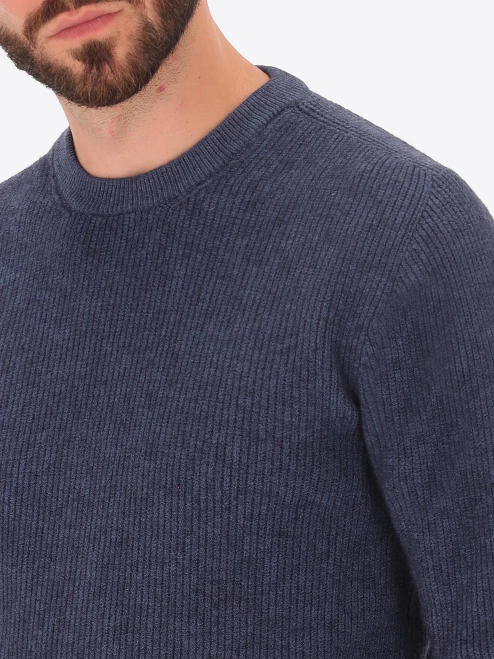 Male model wearing ribbed crew neck knitwear by distretto12 in blue with close up view