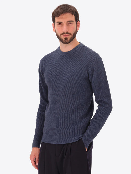 Male model wearing ribbed crew neck knitwear by distretto12 in blue