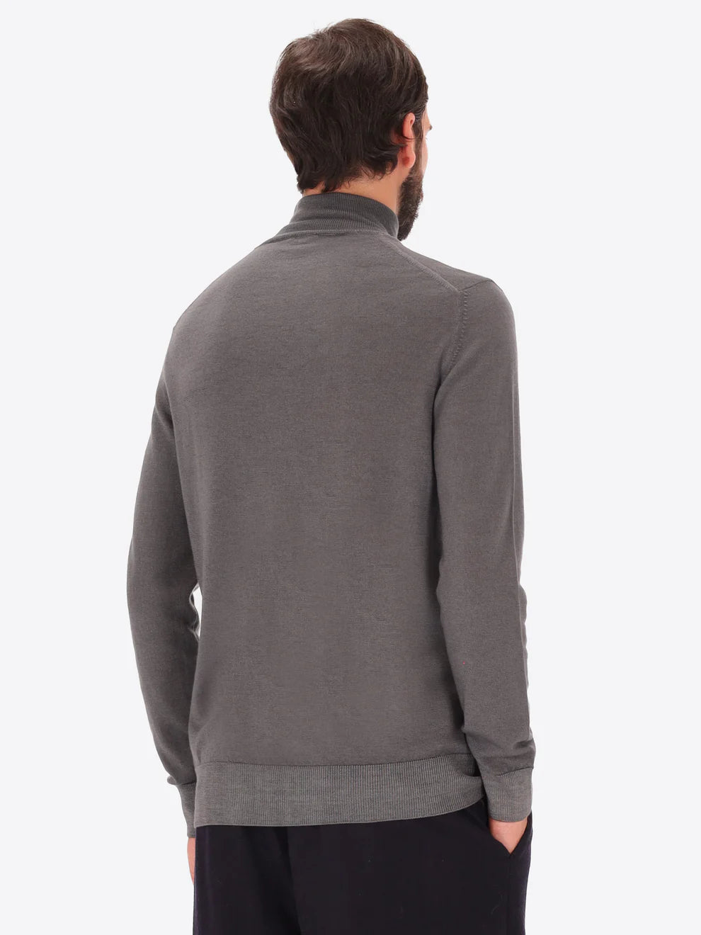 Male model wearing high neck merino blend knitwear by distretto12 in grey with back view