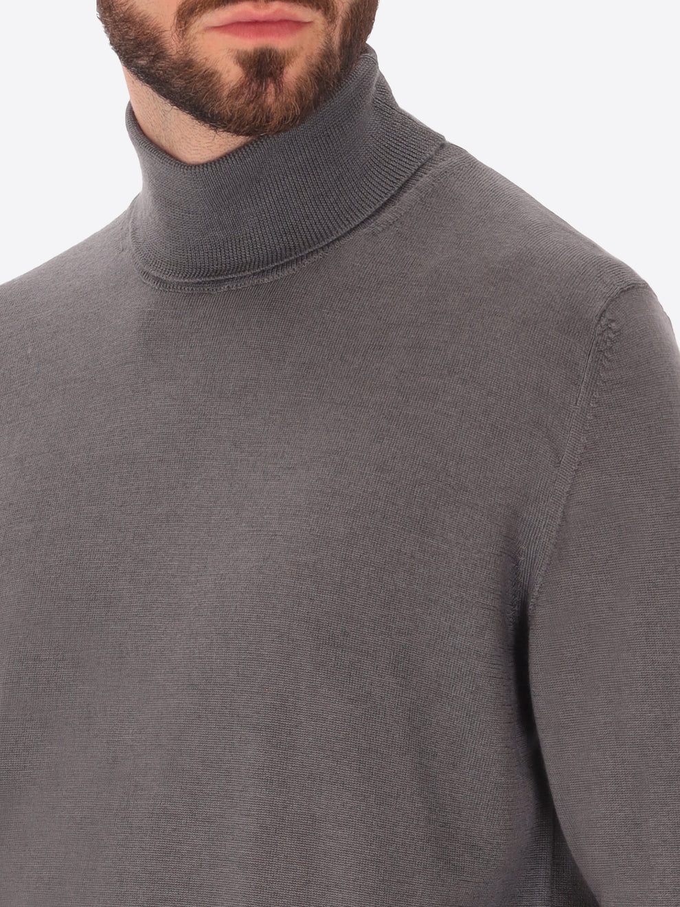 Male model wearing high neck merino blend knitwear by distretto12 in grey with close up view
