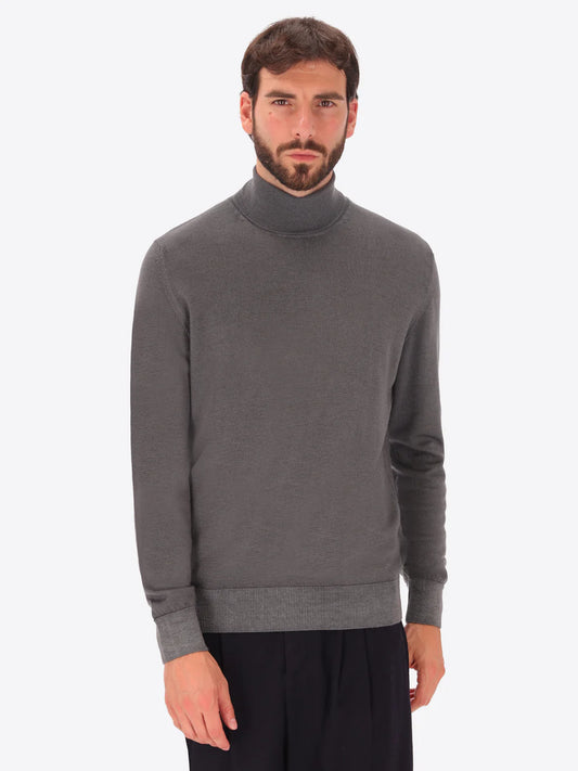 Male model wearing high neck merino blend knitwear by distretto12 in grey