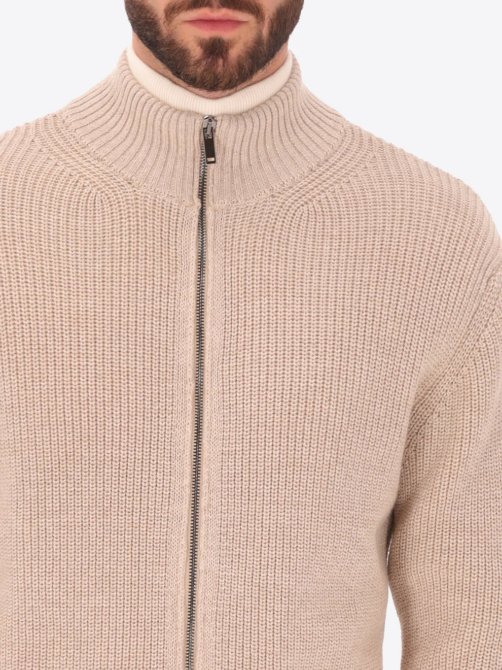 Male model wearing full zip, funnel neck knitwear by distretto12 in dove grey with close up view of zip