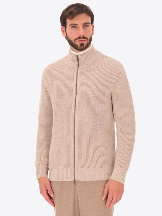 Male model wearing full zip, funnel neck knitwear by distretto12 in dove grey