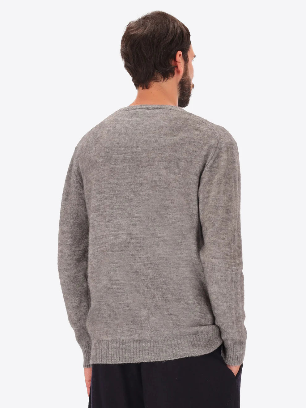 Male model wearing crew neck alpaca blend knitwear by distretto12 in grey with back view