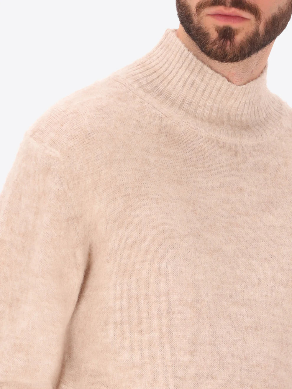 Male model wearing high neck alpaca blend knitwear by distretto12 in cream colour with close up view