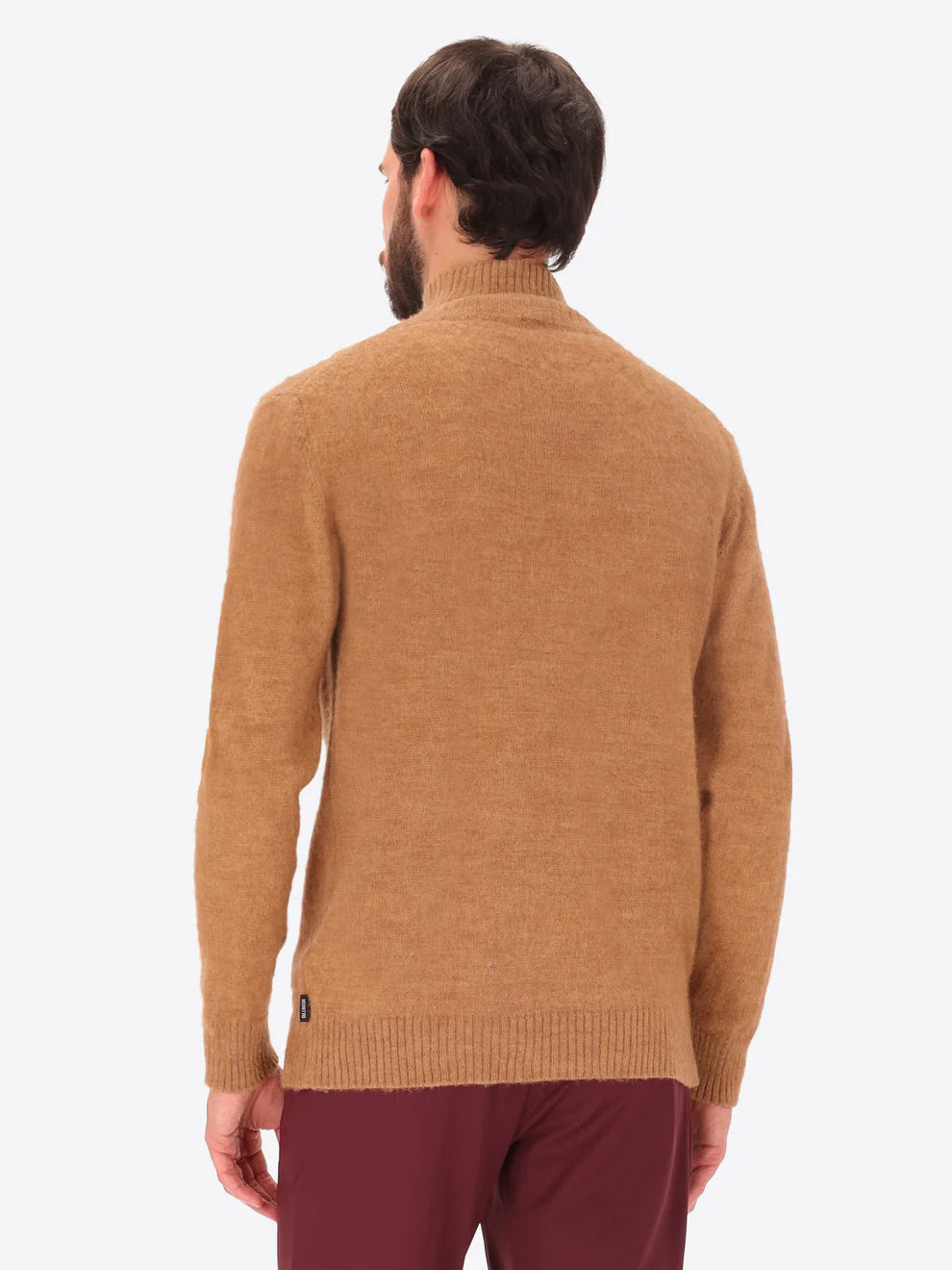 Male model wearing high neck alpaca blend knitwear by distretto12 in tobacco colour with back view