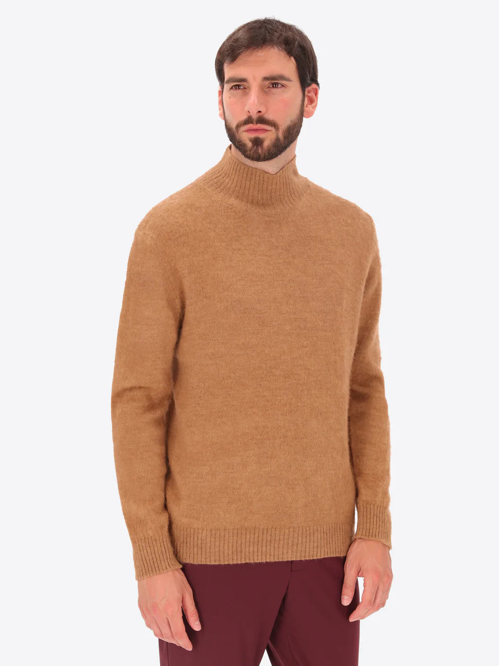 Male model wearing high neck alpaca blend knitwear by distretto12 in tobacco colour