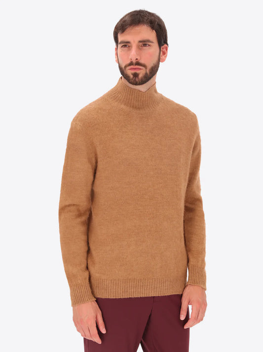Male model wearing high neck alpaca blend knitwear by distretto12 in tobacco colour