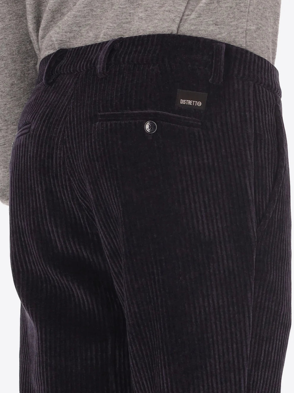 Navy corduroy style Distretto12 trousers on a male model with back pockets shown
