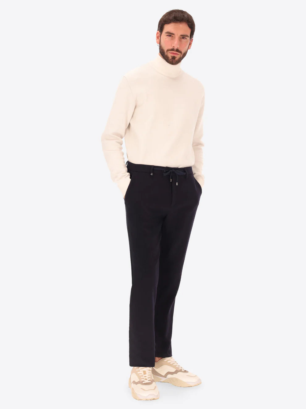 Navy Wool Blend Distretto12 trousers on a male model who is also wearing a wool rollneck knitwear
