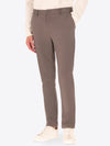 A model wearing a Distretto12 High Performance trousers in matte grey.