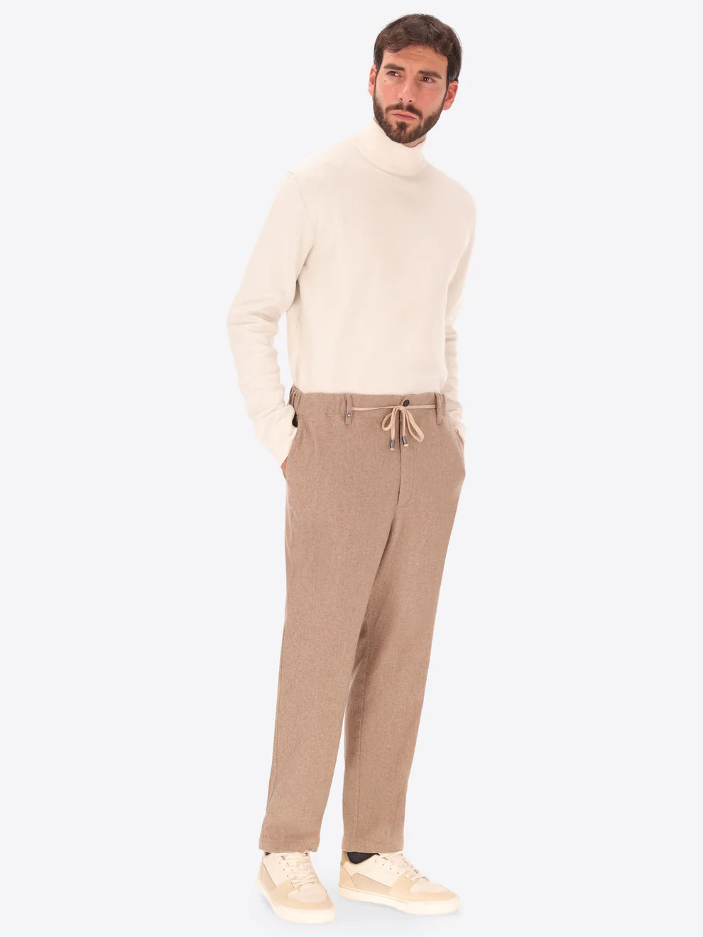 Beige Wool Blend Distretto12 trousers on a male model also wearing a cream knitted 