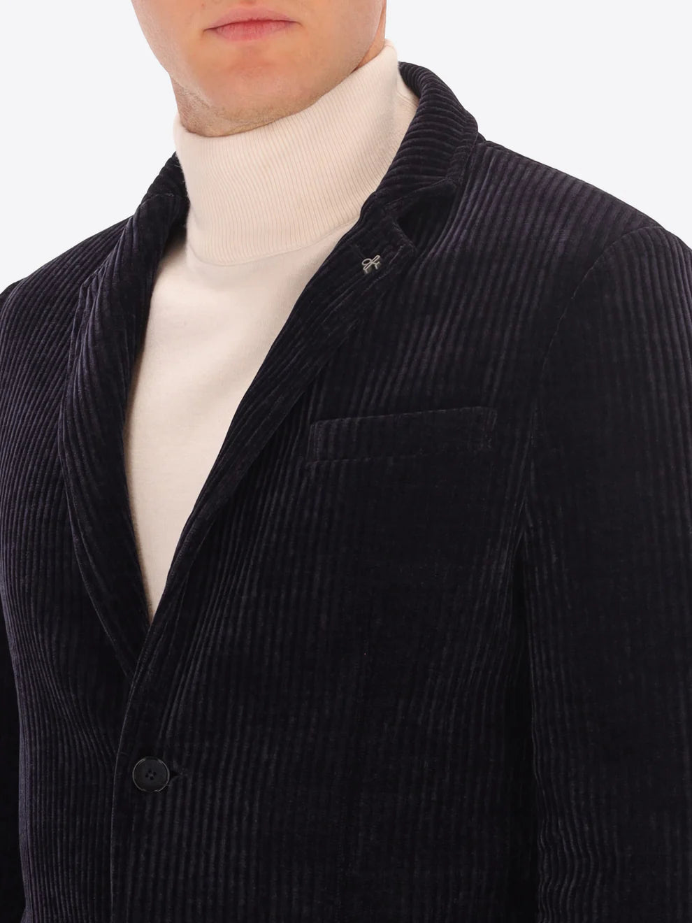 Male model wearing corduroy jacket by distretto12 in navy with close up view