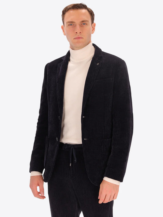 Male model wearing corduroy jacket by distretto12 in navy