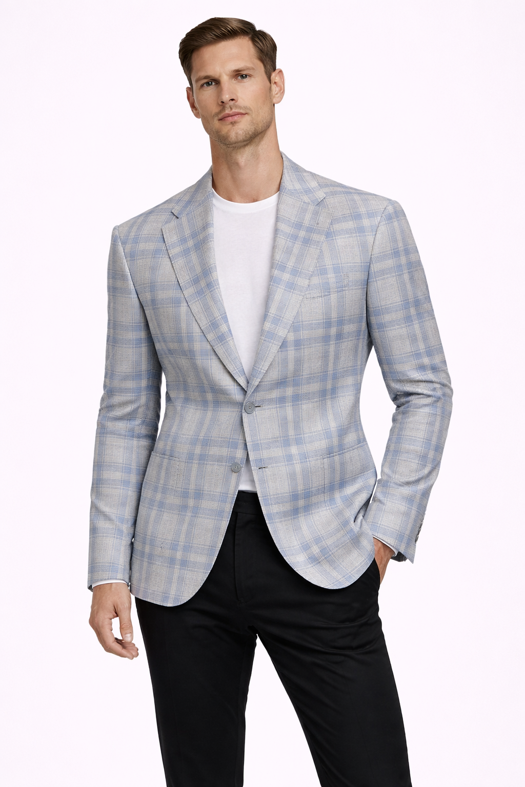 A model wearing a light blue cotton suit from RPL with a check pattern