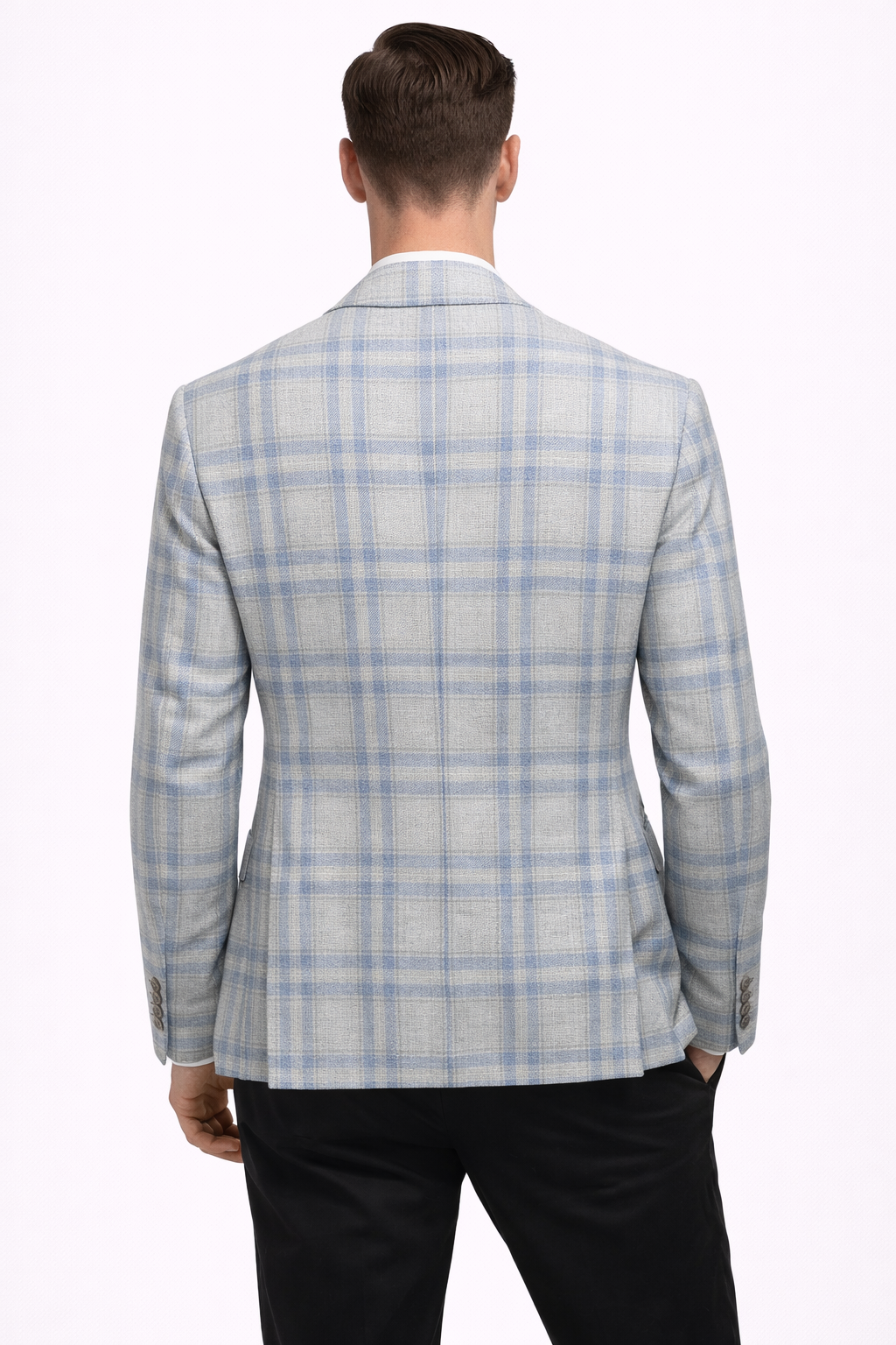 A model wearing a light blue cotton suit from RPL with a check pattern from behind