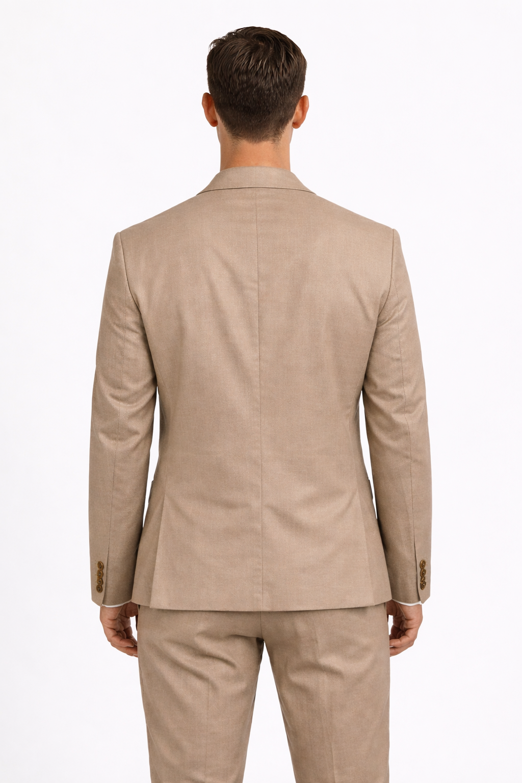 A from behind image of a model wearing a cotton blend suit from RPL in beige