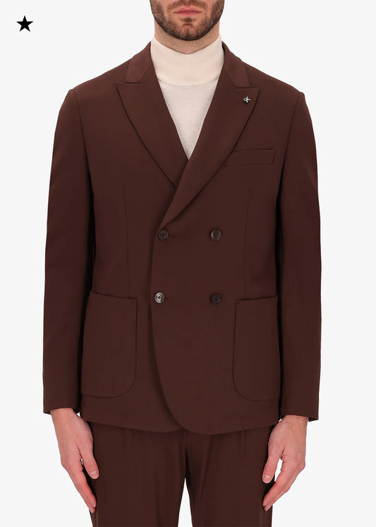 An image of a model wearing double breasted jacket High Performance in brown from Distretto 12.