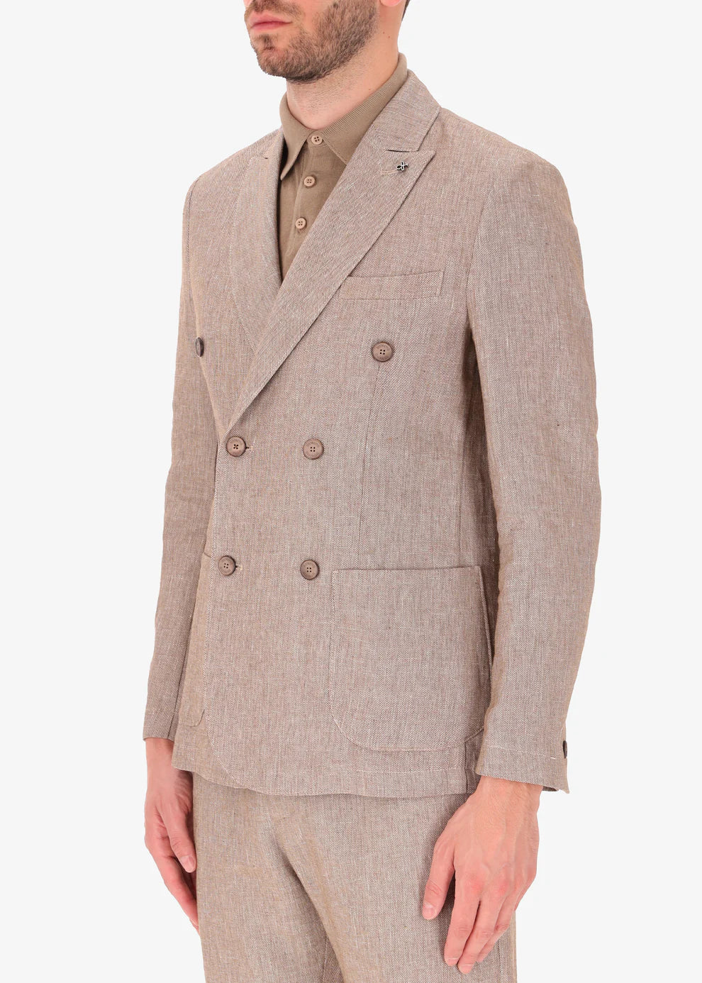 A side facing picture of a model wearing a linen double breasted blazer from Distretto 12.