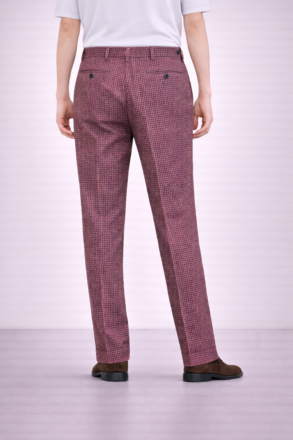 A model wearing Germano 1952 maroon corduroy trousers from behind. 
