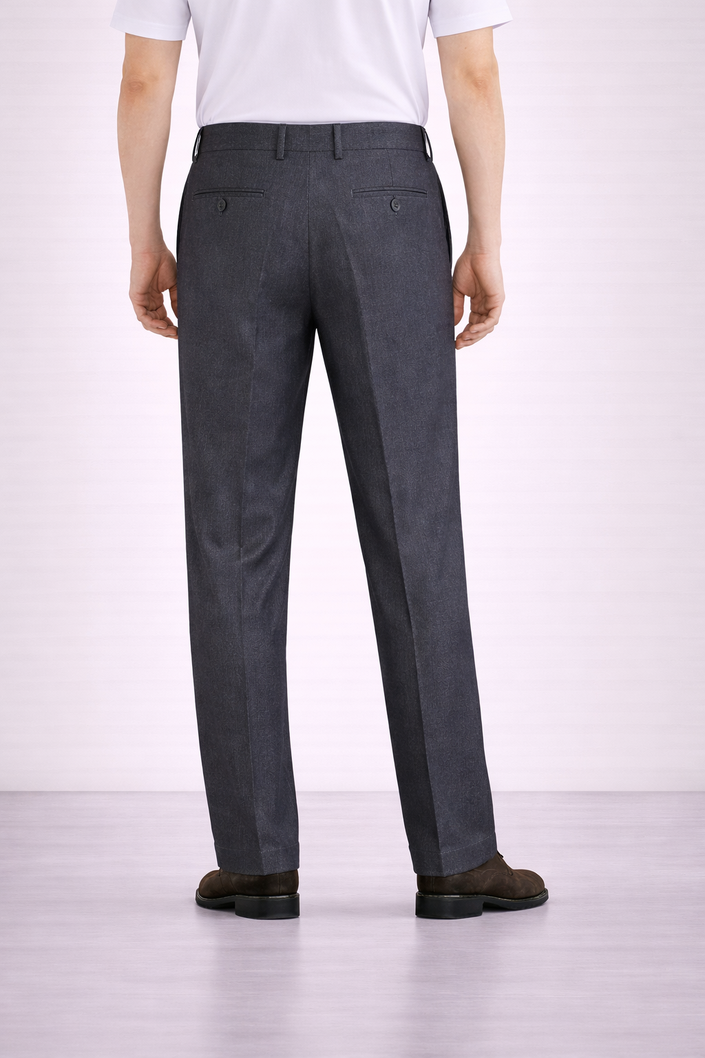 A model wearing Germano 1952 charcoal grey trousers double pleat from behind.