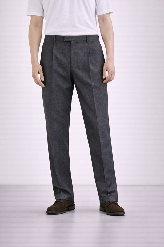 A model wearing Germano 1952 charcoal grey trousers double pleat.