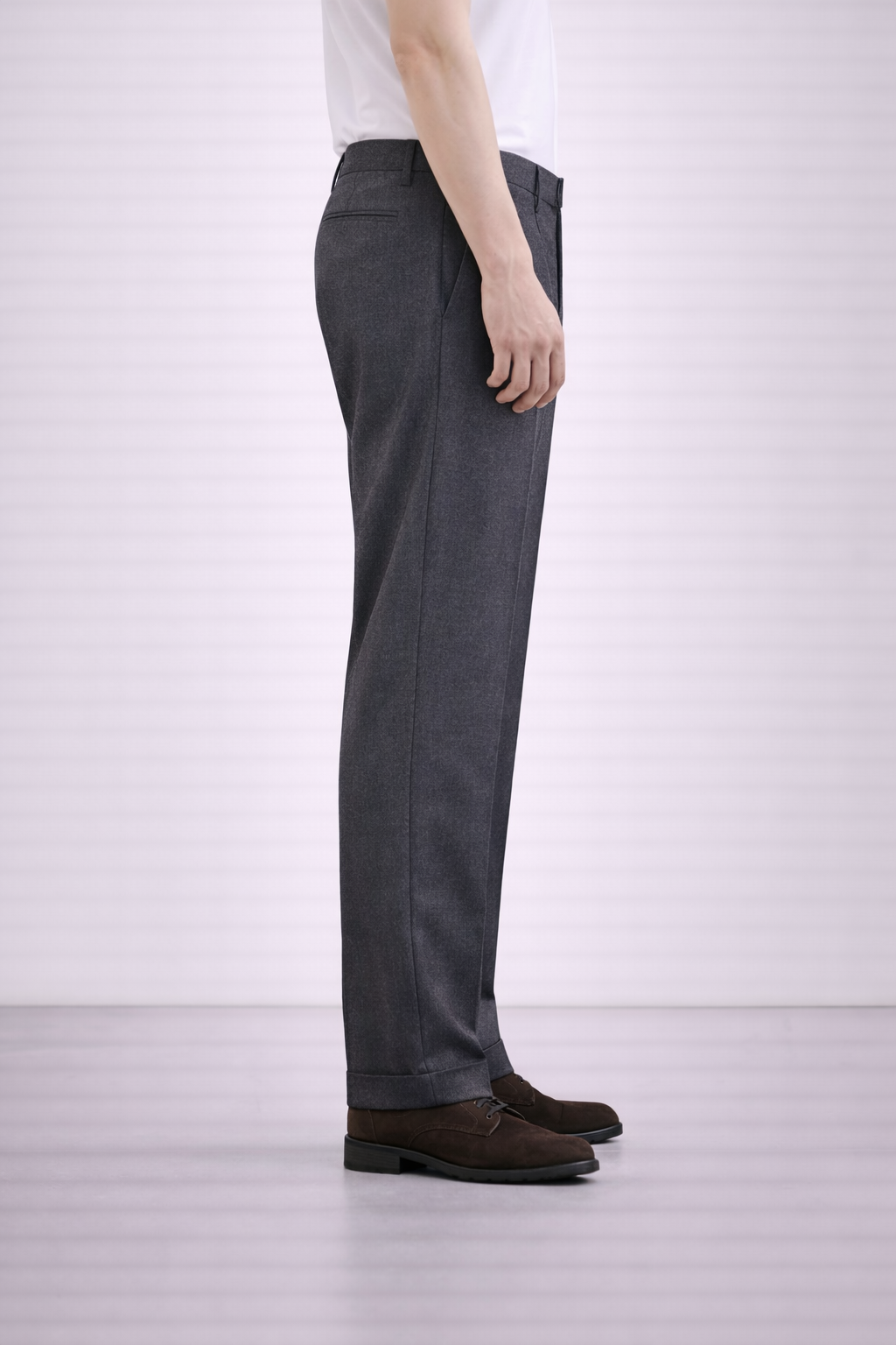 A model wearing Germano 1952 charcoal grey trousers double pleat from the side.