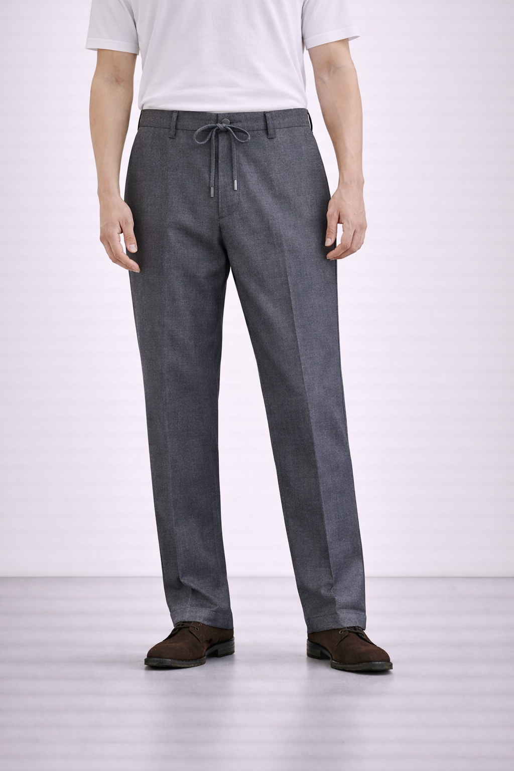 An image of a model wearing Germano 1952 grey drawstring trousers with pleat.