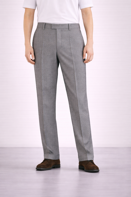 A model wearing Germano 1952 grey trousers with micro pattern.