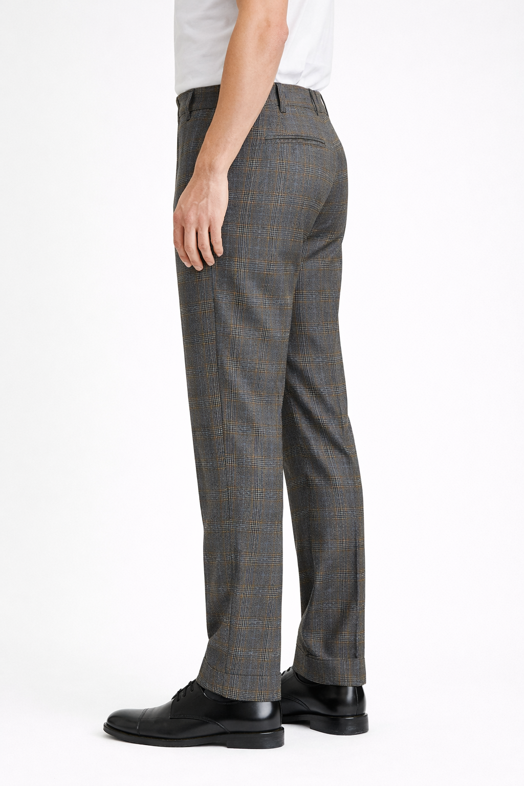 A side on image of a model wearing Germano 1952 trousers with check containing blue & grey.