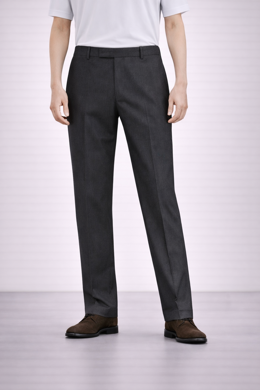 An image of a model wearing Germano 1952 charcoal trousers with slim fit and single pleat.