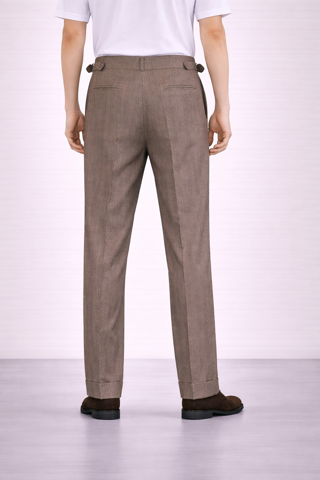 A back angled image of a model wearing Germano 1952 ghurka trousers with double pleat.