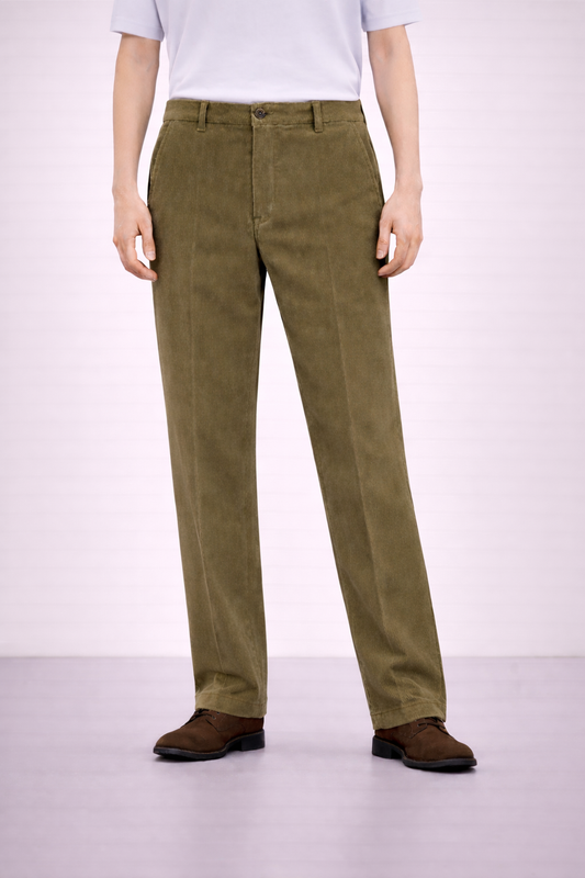 An image of a model wearing Germano 1952 olive moleskin trousers with a single pleat.
