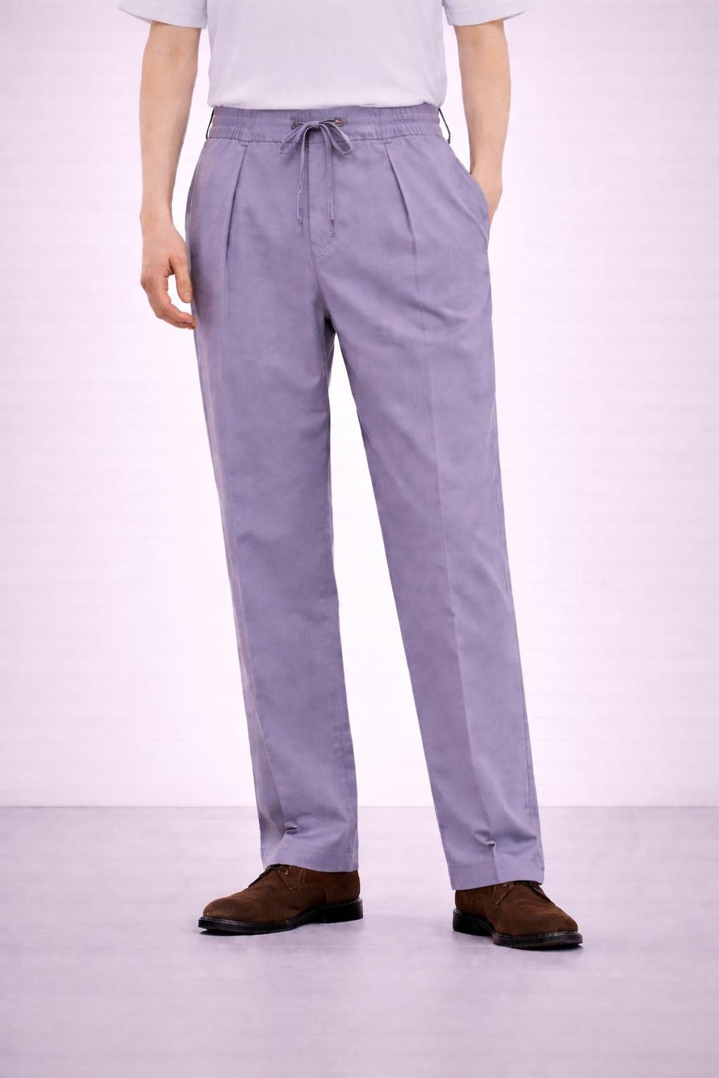 A model wearing Germano 1952 lilac drawstring trousers with single pleat. 