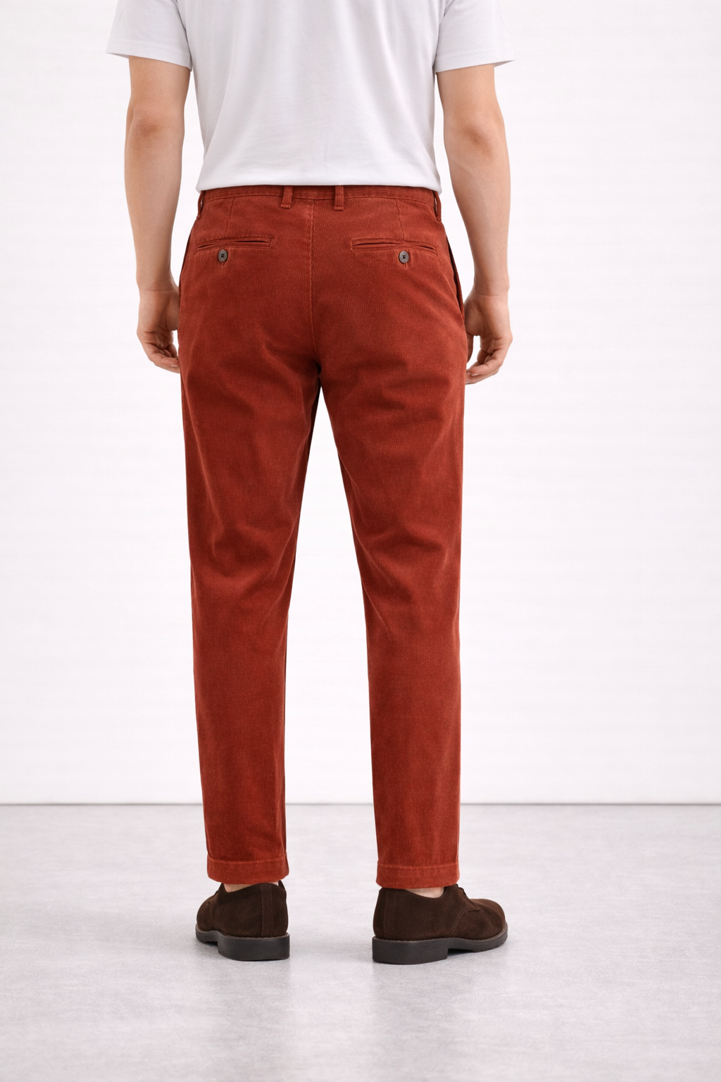 A back facing image of a model wearing Germano 1952 corduroy trousers.