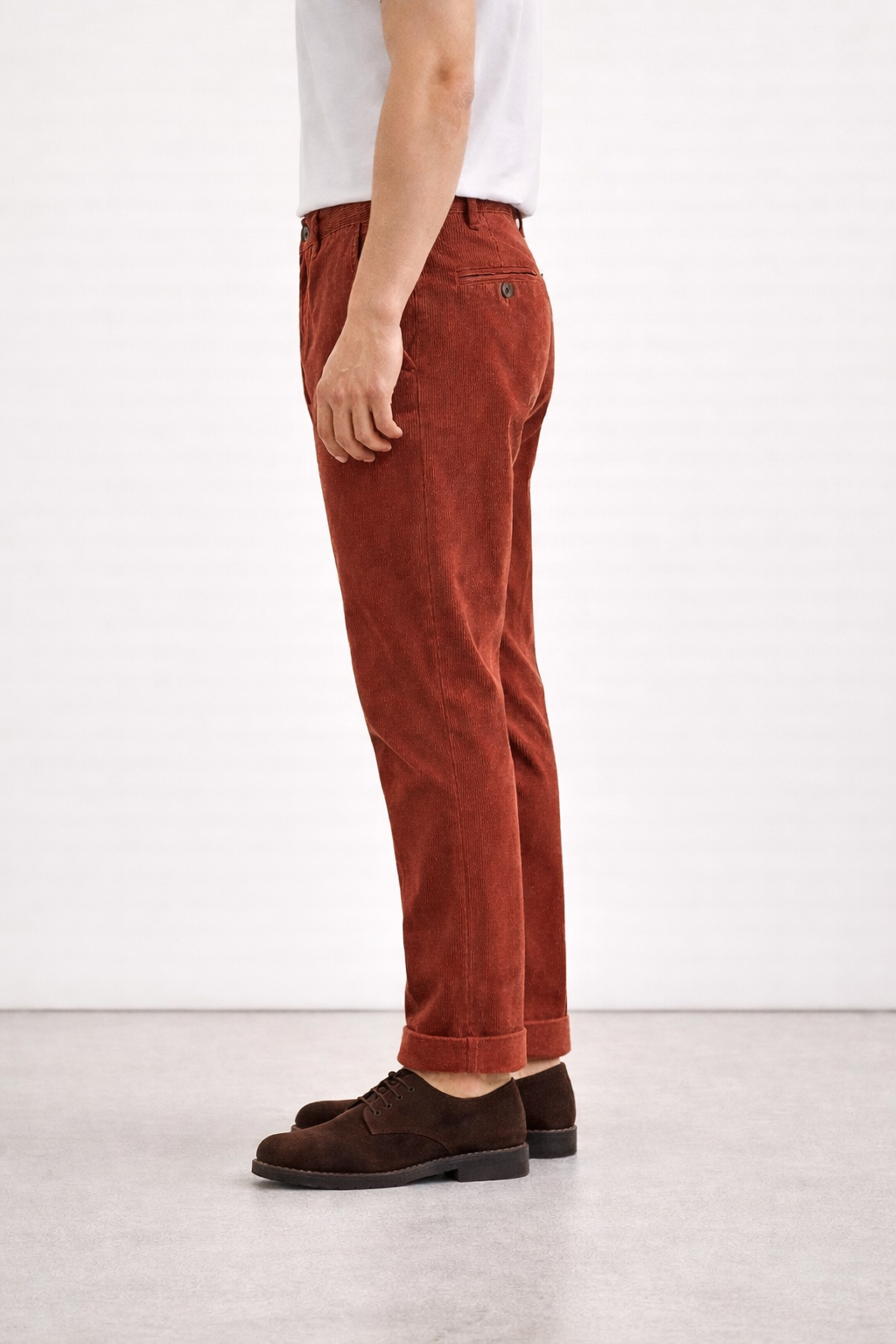 A side on image of a model wearing Germano 1952 corduroy trousers.